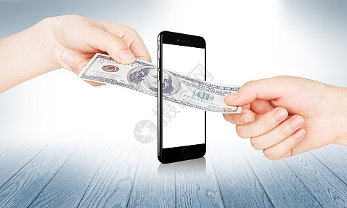 美元钞票通过手机来交易高清图片