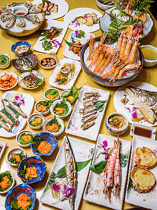 海鲜刺身拼盘日式料理刺身烤物大餐背景
