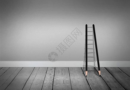 灰色空间的铅笔梯子图片