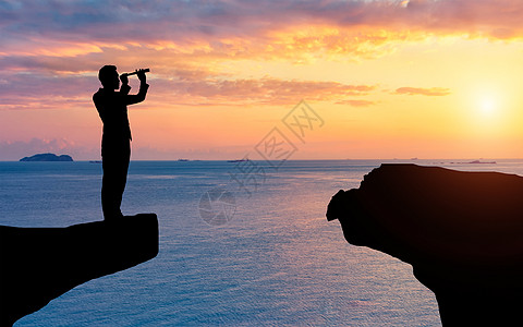 断崖上低头行走商务男士剪影图图片