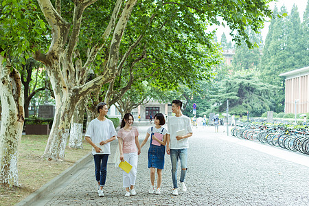 同伴们大学校园男女同学结伴而行背景