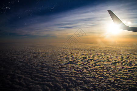 科技蓝色星空迎着朝阳的飞机背景