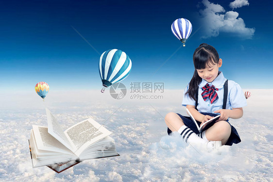 坐在云上看书的小女孩背景图片