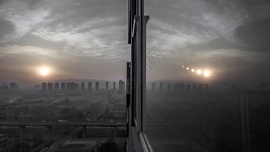 城市雾霾落日夕阳建筑天际线高清图片
