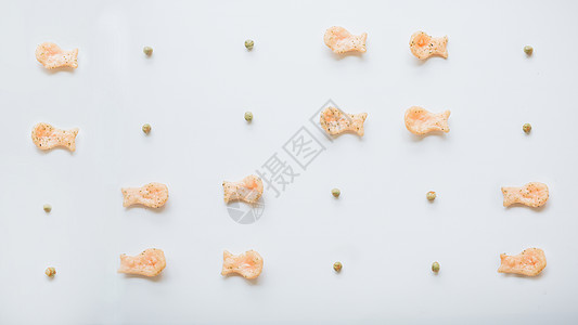 鱼果豌豆零食创意平铺素材图片