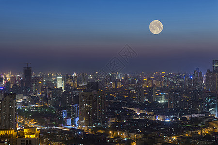 中秋团圆毛笔字城市上空的中秋月背景