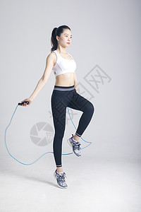 跳绳运动的健身女性背景图片