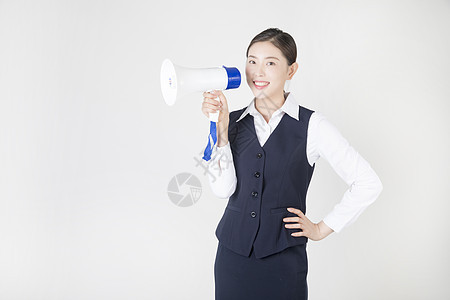 商务女性用喇叭喊口号背景图片