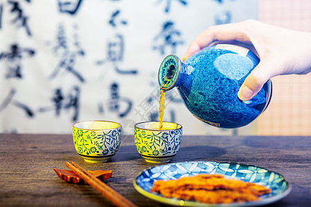 筷子文化古典酒坛酒杯倒酒素材背景