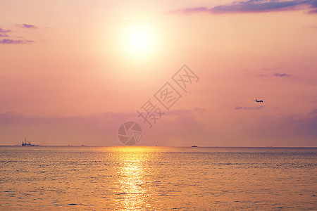 飞机大海香港海边日落背景