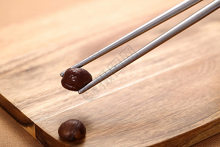 筷子夹豆子背景图片