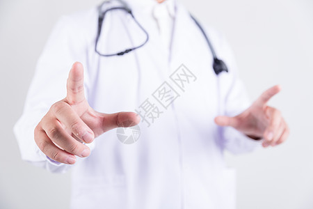 穿白大褂的医生手指点触动作背景图片