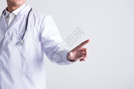 穿白大褂的医生手指点触动作背景图片