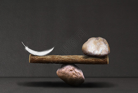 羽毛与石头的平衡设计图片