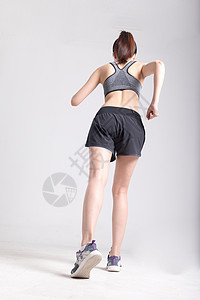 运动女性跑步背影图片