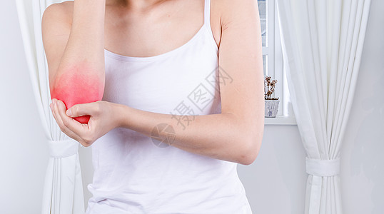 手肘疼痛的女性背景图片