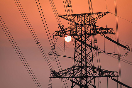 日落下的电力铁塔背景图片