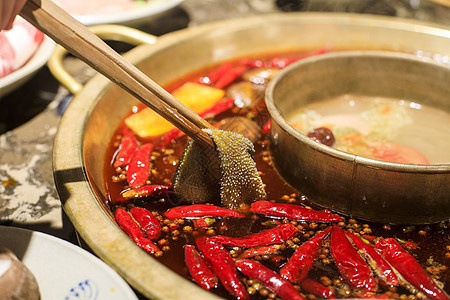 一个红辣椒中国特色美食火锅背景