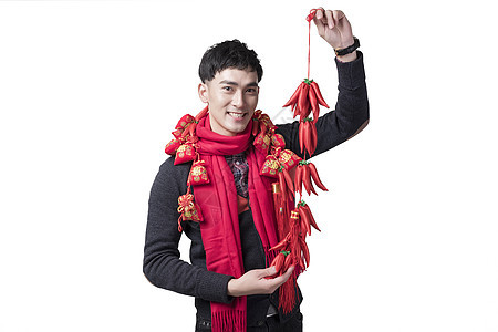 春节喜庆男士人像手持红辣椒背景图片