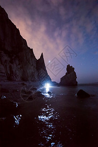 黑夜灯塔暗夜海岸星空背景