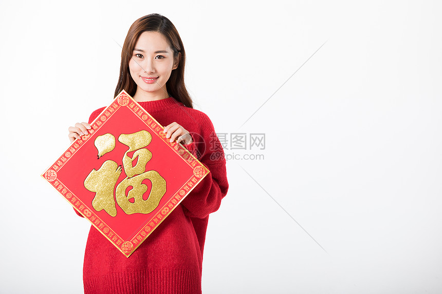 新年女性拿福字白底棚拍图片