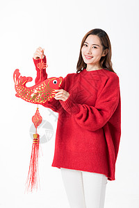 新年女性拿红色中国结高清图片