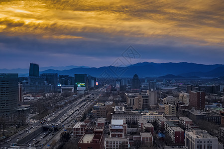日落西山的城市背景图片