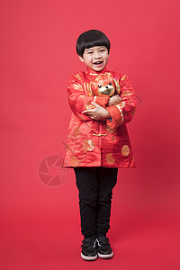 春节狗新年拿着玩具狗的小朋友背景