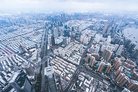 上海雨雪天气城市建筑全景背景图片