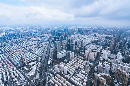 上海雨雪天气城市建筑全景背景图片