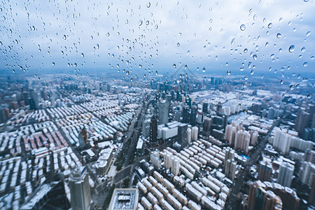上海雨雪天气城市建筑全景背景图片