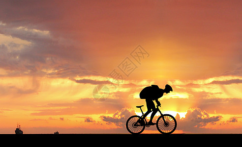 夕阳下骑车人高清图片