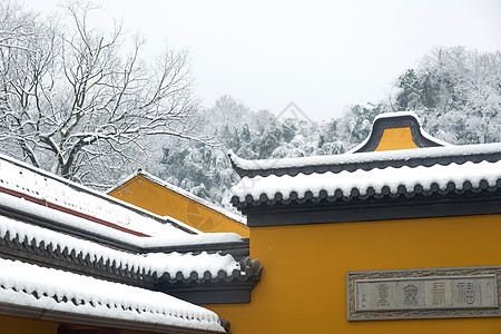 雪中的寺庙古建筑佛墙高清图片