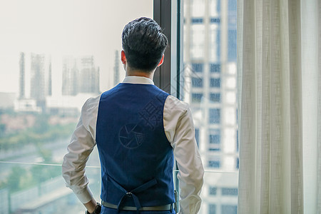 商务人背影站在窗前的背景背景