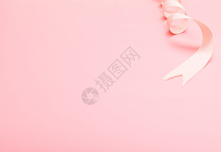 粉色背景丝绸缎带静物图片
