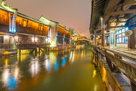 城市街道雪景浙江乌镇雪后夜景背景