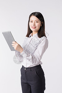 职场女性手拿平板电脑背景图片