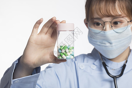 护士药物药品医护人员手拿药品背景