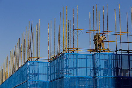 工作辛苦建筑的工人背景