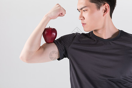 青年男性苹果健身男性手拿苹果背景