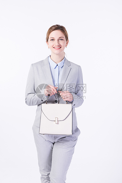 开心提包的外国商务女性图片