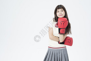 戴着拳击手套的女学生图片