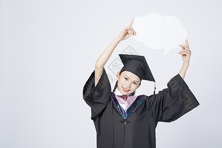 拿着文字框的毕业女学生图片