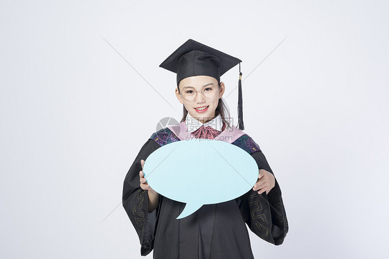 拿着文字框的毕业女学生图片