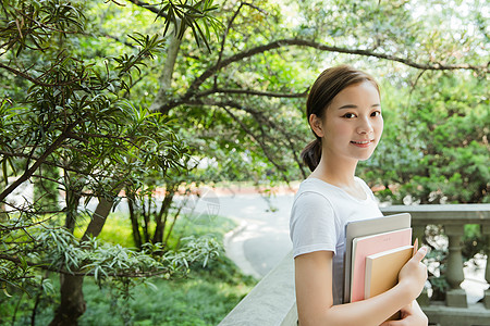 毕业人物青春大学生抱着书本背景