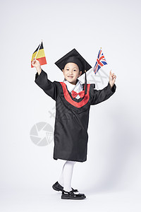 儿童留学拿着国旗的毕业小女孩背景