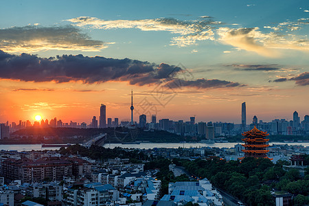 长江航道日落时分的长江主轴黄鹤楼长江大桥景观背景