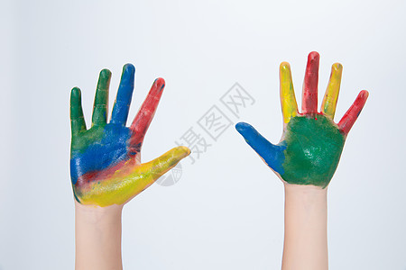 六一儿童节涂满颜料的手背景