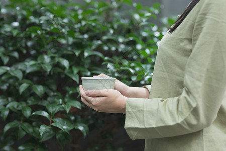 手捧茶杯背景