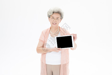 老年奶奶使用平板电脑背景图片